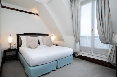 Un ou plusieurs lits dans un hébergement de l'établissement Hôtel Pont Royal Paris