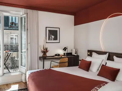 Un ou plusieurs lits dans un hébergement de l'établissement Seven Hotel Paris