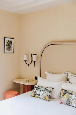 Un ou plusieurs lits dans un hébergement de l'établissement Hôtel Bienvenue