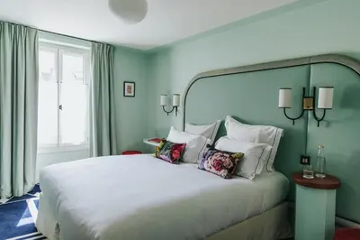 Un ou plusieurs lits dans un hébergement de l'établissement Hôtel Bienvenue