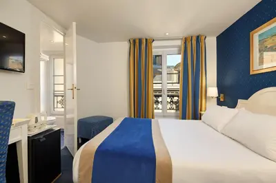 Un ou plusieurs lits dans un hébergement de l'établissement Austin's Arts Et Metiers Hotel