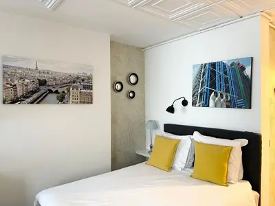 Un ou plusieurs lits dans un hébergement de l'établissement Appartement Seine et Marais