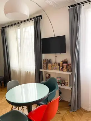Télévision ou salle de divertissement dans l'établissement Appartement Seine et Marais