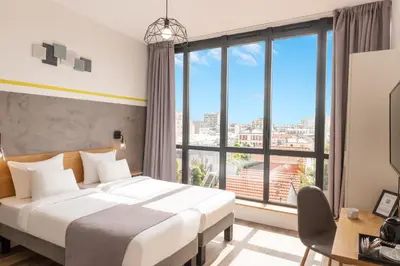 Un ou plusieurs lits dans un hébergement de l'établissement Hotel Terre Neuve