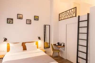 Un ou plusieurs lits dans un hébergement de l'établissement Hotel Terre Neuve