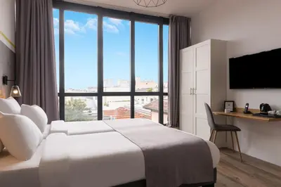 Un ou plusieurs lits dans un hébergement de l'établissement Hotel Terre Neuve