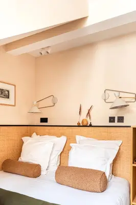 Un ou plusieurs lits dans un hébergement de l'établissement Hôtel Maison Traversière