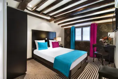 Un ou plusieurs lits dans un hébergement de l'établissement Hotel Pax Opera
