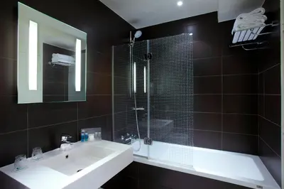 Salle de bains dans l'établissement Holiday Inn Paris Opéra - Grands Boulevards by IHG