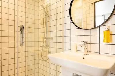 Salle de bains dans l'établissement Hotel SUB