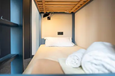 Un ou plusieurs lits dans un hébergement de l'établissement Hotel SUB