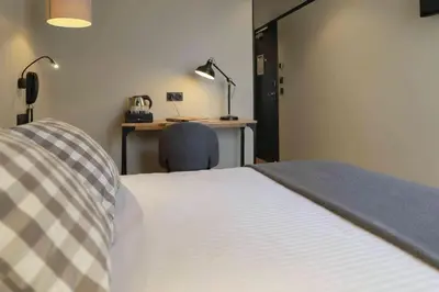 Un ou plusieurs lits dans un hébergement de l'établissement Hotel SUB