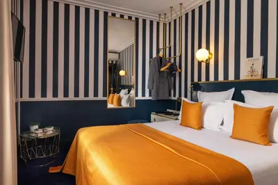 Un ou plusieurs lits dans un hébergement de l'établissement Hôtel Léna