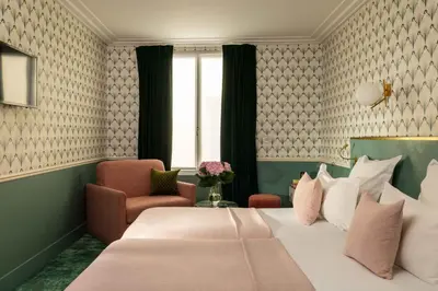 Un ou plusieurs lits dans un hébergement de l'établissement Hôtel Léna