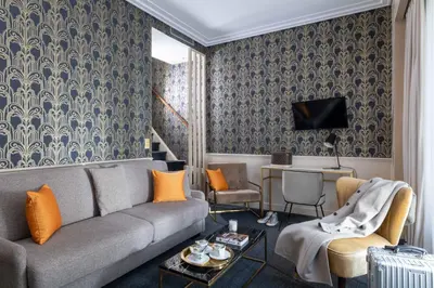 Télévision ou salle de divertissement dans l'établissement Hôtel Léna