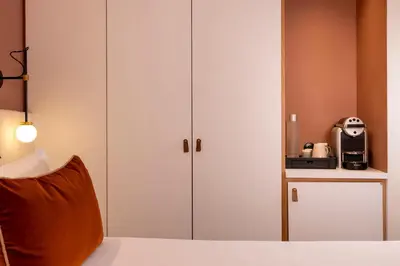 Un ou plusieurs lits dans un hébergement de l'établissement Hotel Chavanel