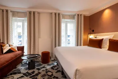 Un ou plusieurs lits dans un hébergement de l'établissement Hotel Chavanel