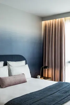 Un ou plusieurs lits dans un hébergement de l'établissement L'Imprimerie Hôtel