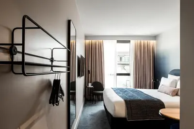 Un ou plusieurs lits dans un hébergement de l'établissement L'Imprimerie Hôtel