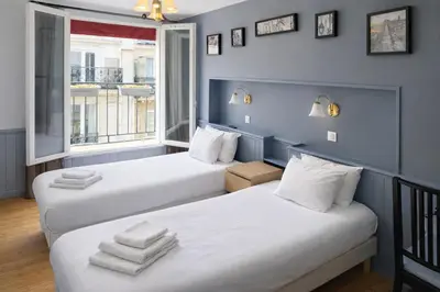 Un ou plusieurs lits dans un hébergement de l'établissement Hôtel Apollo Opéra