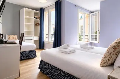 Un ou plusieurs lits dans un hébergement de l'établissement Hôtel Apollo Opéra