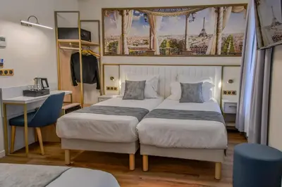 Un ou plusieurs lits dans un hébergement de l'établissement Hôtel des Deux Avenues