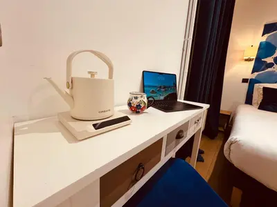 Un ou plusieurs lits dans un hébergement de l'établissement Hôtel L'Amiral