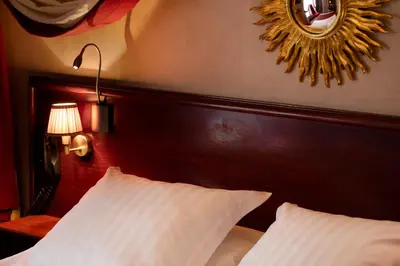 Un ou plusieurs lits dans un hébergement de l'établissement Hotel Britannique