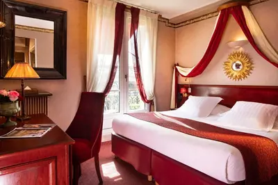 Un ou plusieurs lits dans un hébergement de l'établissement Hotel Britannique