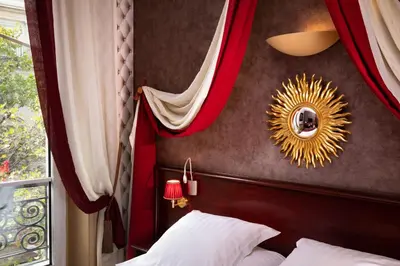 Un ou plusieurs lits dans un hébergement de l'établissement Hotel Britannique