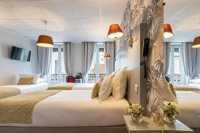 Un ou plusieurs lits dans un hébergement de l'établissement Splendid Hôtel