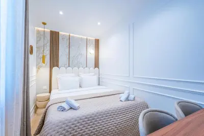 Un ou plusieurs lits dans un hébergement de l'établissement Garbo Hôtel