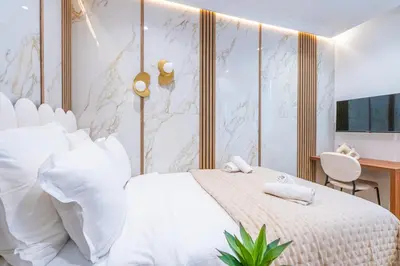 Un ou plusieurs lits dans un hébergement de l'établissement Garbo Hôtel