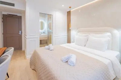 Un ou plusieurs lits dans un hébergement de l'établissement Garbo Hôtel