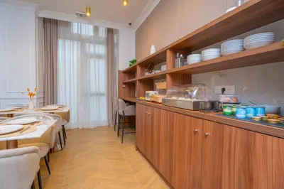 Cuisine ou kitchenette dans l'établissement Garbo Hôtel