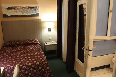 Un ou plusieurs lits dans un hébergement de l'établissement Hotel Excelsior
