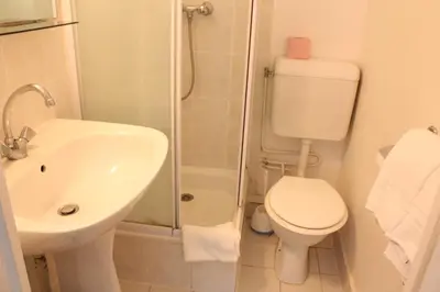 Salle de bains dans l'établissement Hotel Excelsior