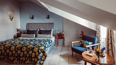 Un ou plusieurs lits dans un hébergement de l'établissement Maison Saintonge