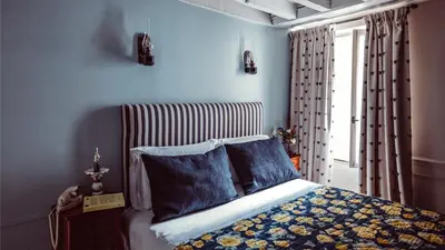 Un ou plusieurs lits dans un hébergement de l'établissement Maison Saintonge
