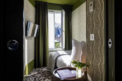 Coin salon dans l'établissement Hôtel La Conversation