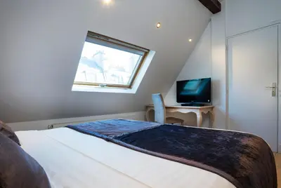 Télévision ou salle de divertissement dans l'établissement Hôtel Du Brésil