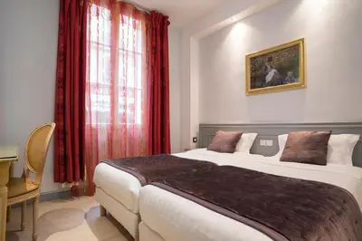 Un ou plusieurs lits dans un hébergement de l'établissement Hôtel Du Brésil