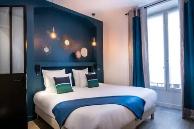 Un ou plusieurs lits dans un hébergement de l'établissement Hôtel Royal Opéra