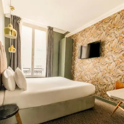 Télévision ou salle de divertissement dans l'établissement Hotel Paradis