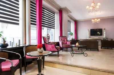 Télévision ou salle de divertissement dans l'établissement Hotel Corona -Rodier-