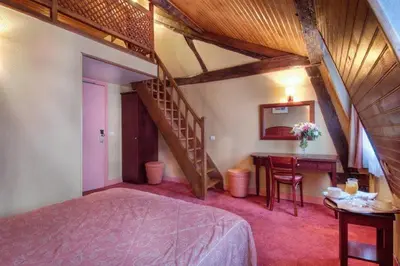 Un ou plusieurs lits dans un hébergement de l'établissement Hotel Le Faubourg Opera
