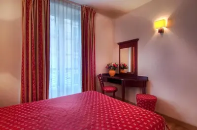 Un ou plusieurs lits dans un hébergement de l'établissement Hôtel De Paris Opera