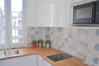 Cuisine ou kitchenette dans l'établissement Longchamp Apartment