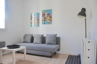 Coin salon dans l'établissement Longchamp Apartment
