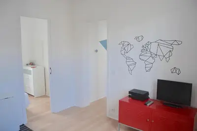 Télévision ou salle de divertissement dans l'établissement Longchamp Apartment